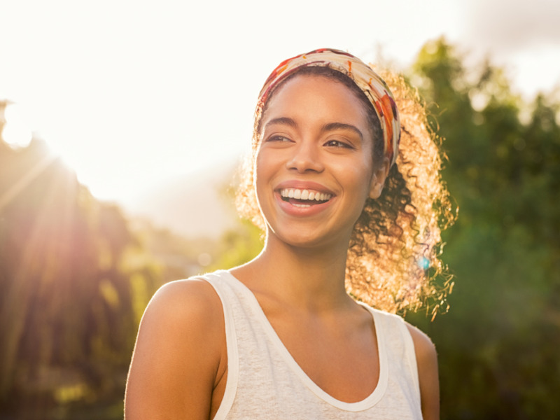 Portrait Of Beautiful African American Woman Smiling And Looking Away