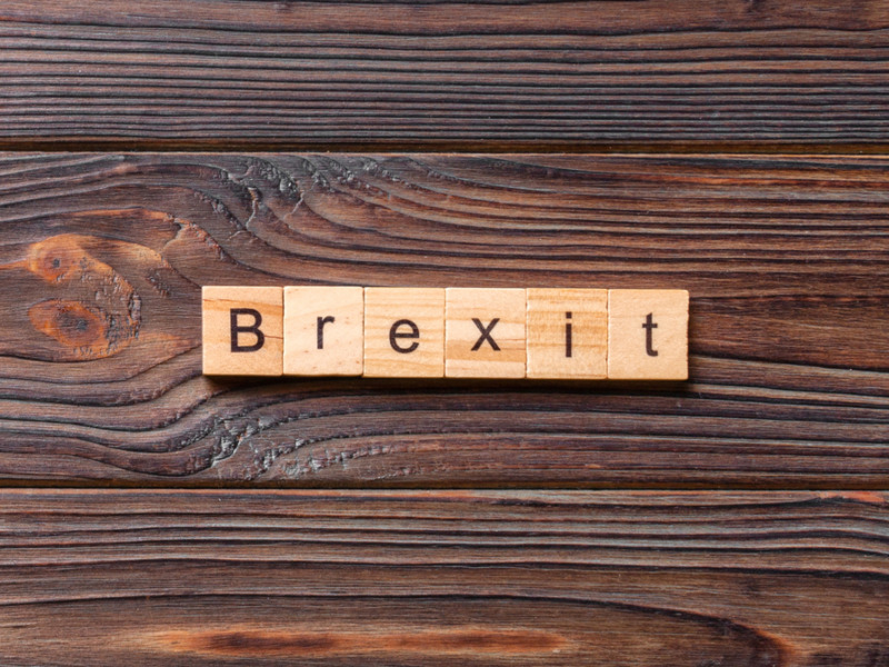 Brexit Word Written On Wood Block. Brexit Text On Cement
